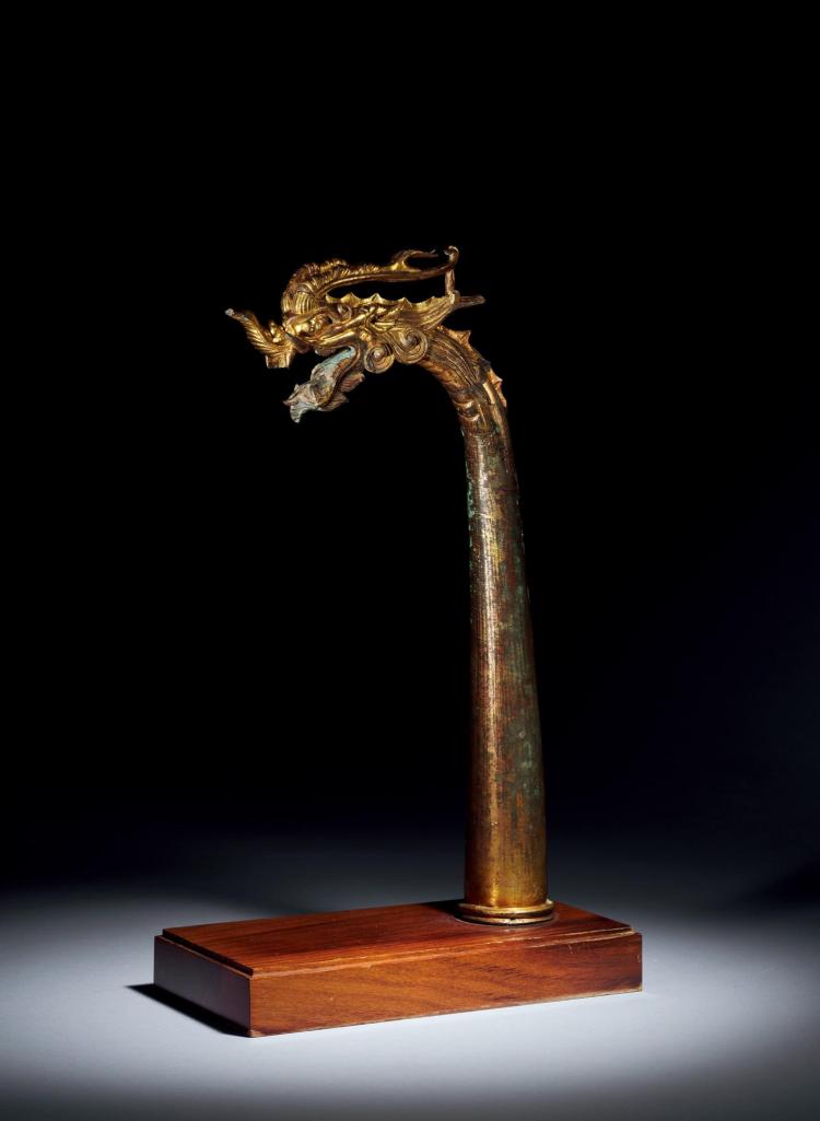 LOT 287 A FINE BRONZE GILDED DRAGON HEAD TANG DYNASTY